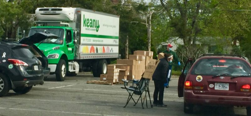Keany Produce van at a curbside delivery drop point.