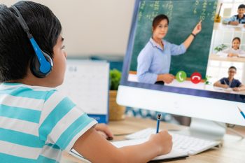 boy participating in distance learning