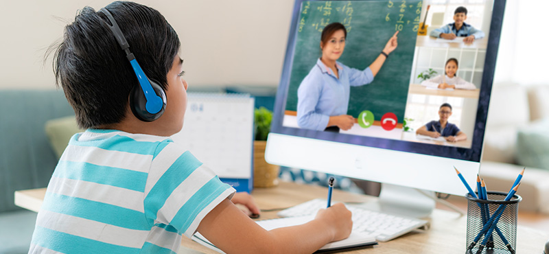 boy participating in distance learning